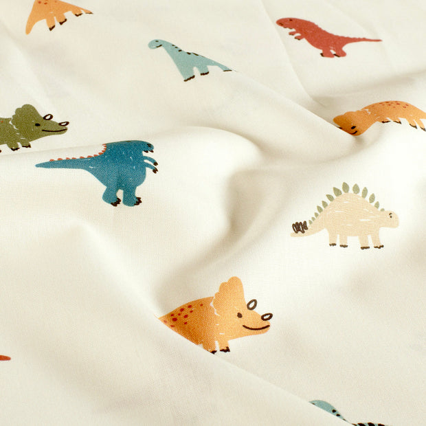 Cotton Poplin fabric Dinosaurs Off White